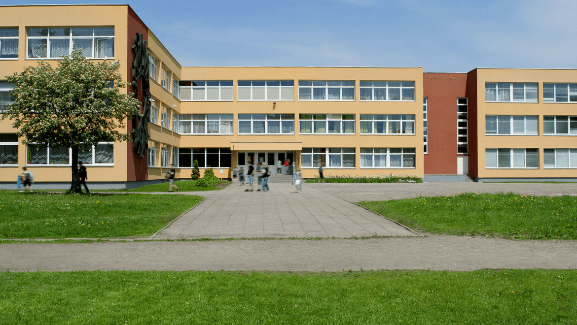 School with a tree and lawn