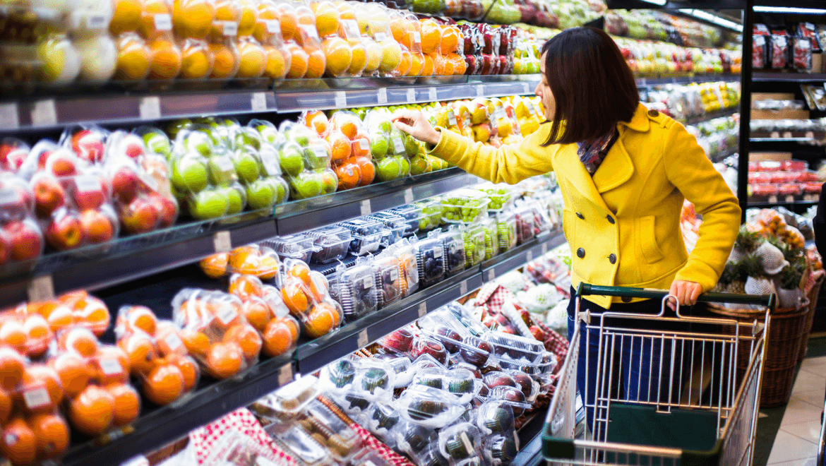 Fruit and vegetable display in a supermarket fridge enlighten