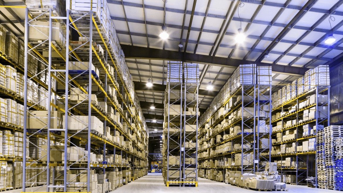 Warehouse with high ceiling and large illuminated shelves