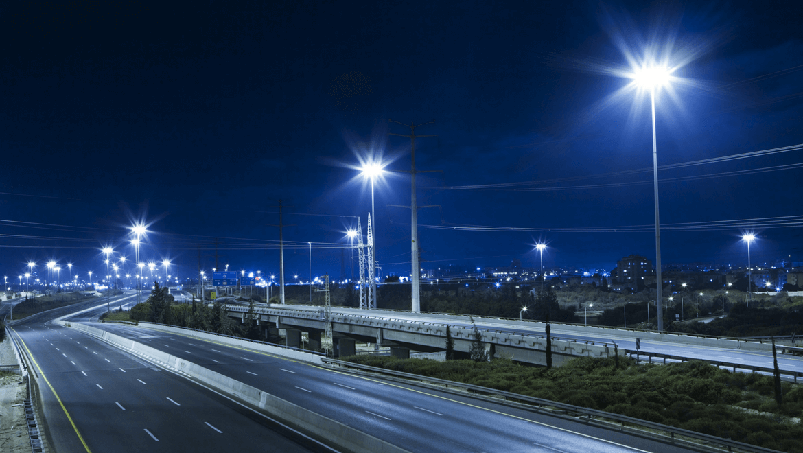 Light in cities: Road illuminated by LED street lights at night