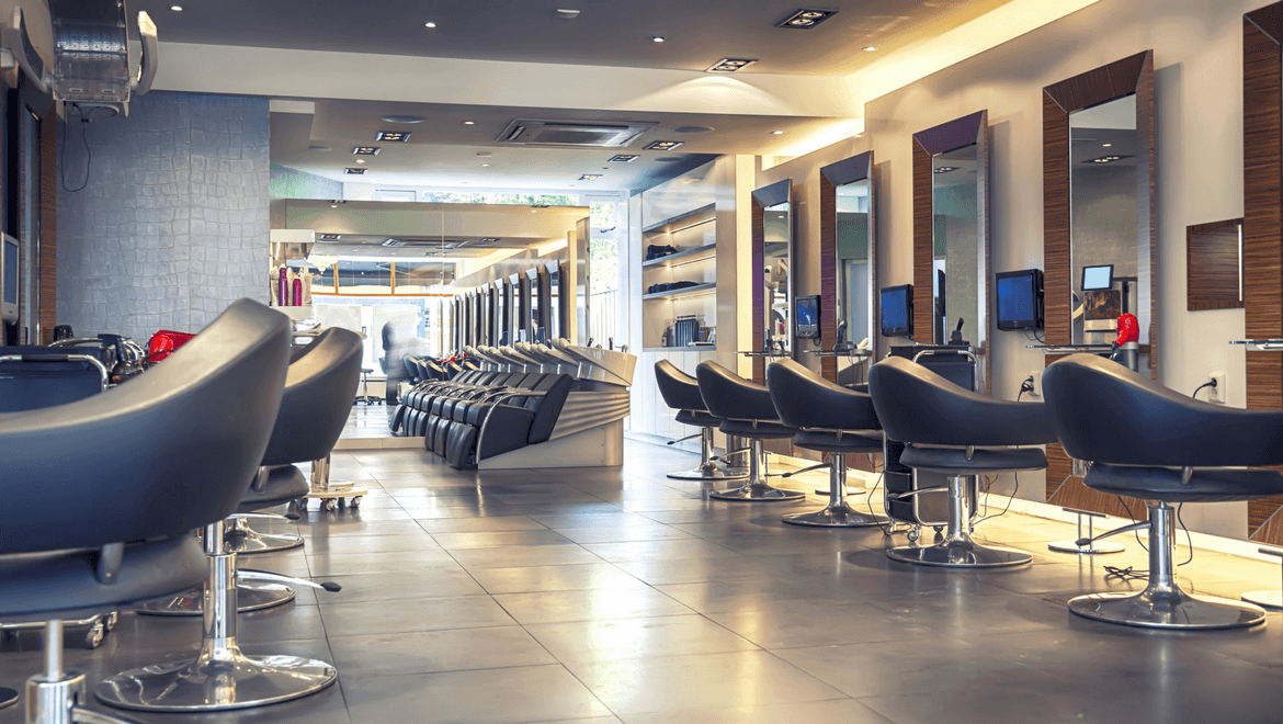 Hair salon lighting: lighted hairdresser with chairs and mirrors