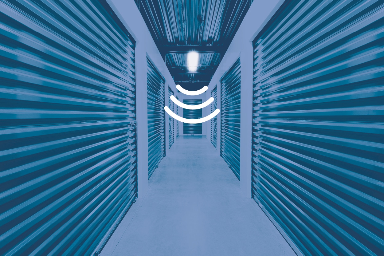 stocking warehouse corridor lighted by a programmable lighting represented by the integrated motion sensor icon with 3 lines next to the LED tri-level strip light